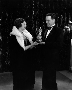 Presenter Jack Cunningham gives writer Frances Mario the Best Writing Oscar for The Big House. 