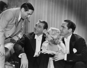 Ernst Lubitsch on the left with Gary Cooper, Miriam Hopkins, and Frederic March on the set of Design for Living (1933).