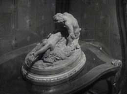 And a nice little pan from suggestive statue, to discarded clothing, to a pair of hands having a nice time. 