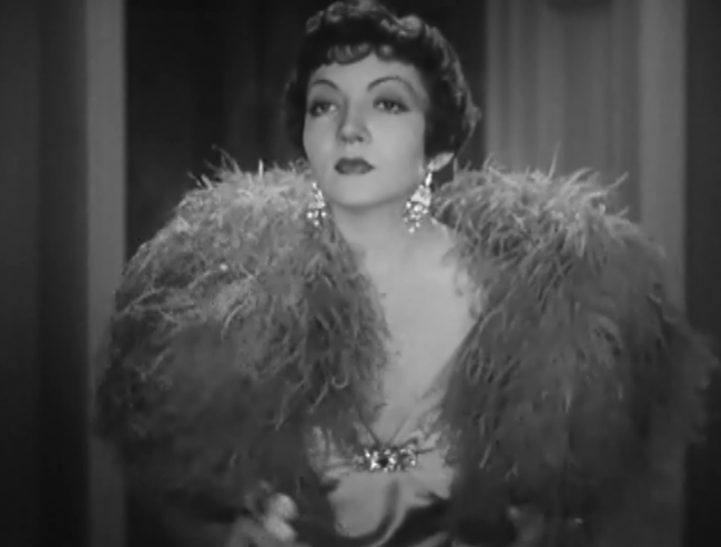 Claudette Colbert's wardrobe is worth seeing. That's why I took screencaps. 
