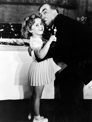 Special Juvenile Award winner Shirley Temple gets a hug from Host Irving S. Cobb. 