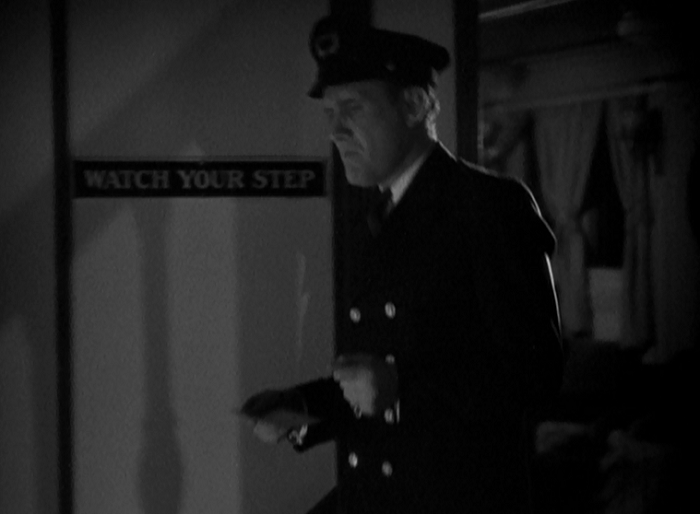 That sign on the wall represents a pretty black gag on Capra's part as the scene before this shows someone losing their step to a near-fatal degree. 