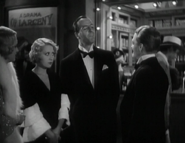 One of the better jokes in the film is that sign behind the quartet of grifters. 