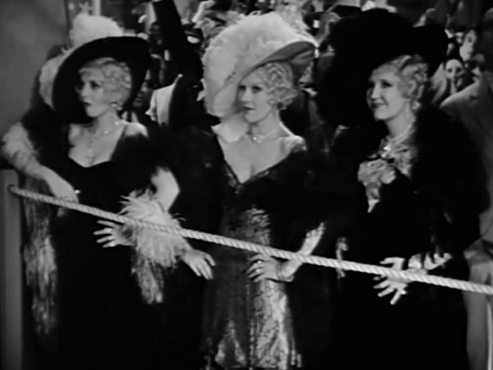 The movie also features not one, but THREE Mae West impersonators. Really, everything but the kitchen sink. 