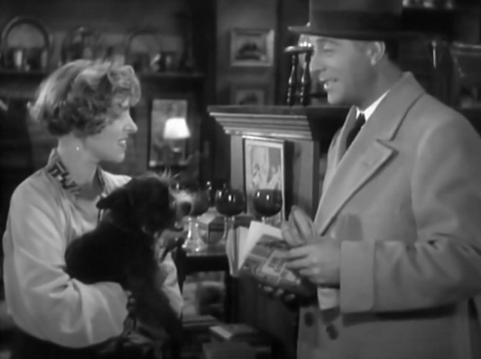 Pre-Code dog alert: the owner of a store where Jimmy sells his paintings has to take out her dog for a minute. Cortez seems perfectly amused with the little pup. 